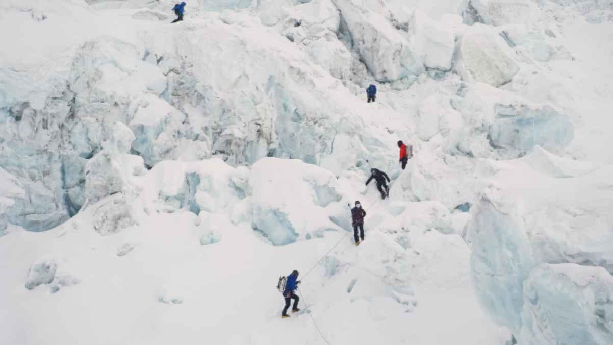 Photos show hundreds of climbers attempting to scale Mount Everest despite the dangers
