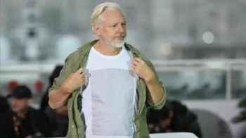 At Cannes.. Assange Wears Shirt Bearing Names of Fallen Gaza Children