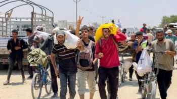 Their homeland—despite all odds... Bread is not enough, but determination nourishes
