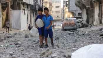 Small faces stealing life from the jaws of war