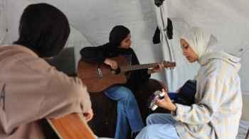 Amid the War, a Melody Grows… Al-Rimal Girls Play for Life