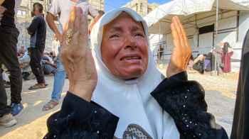 In the face of scorching sun, shelling, and hunger... a prayer that never breaks
