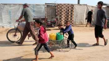Here is Gaza… Innocence pulls water carts instead of playing