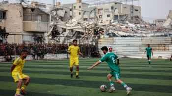 In a city without stadiums… Gazans create their own football field from the rubble