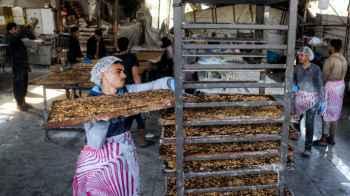 The miracle makers in Gaza prepare "Eid sweets" amid the bitterness of life