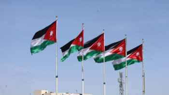 Between the sky and the earth… a flag called the homeland