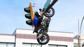Video Shows Motorcycle Hanging from Traffic Light After Crash in Canada